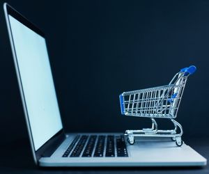 ecommerceBlogImage Image of a shopping cart on top of a laptop